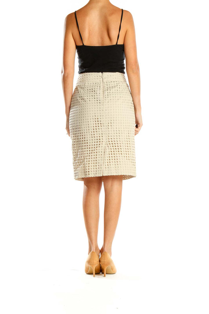 Side view of Banana Republic beige textured pencil skirt on model