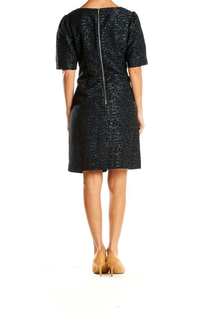 Side view of Adrianna Papell black textured cocktail dress showing puff sleeves