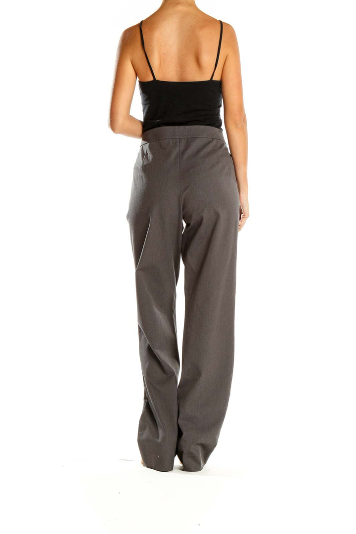 Side view of DKNY gray wide-leg trousers on model with black top