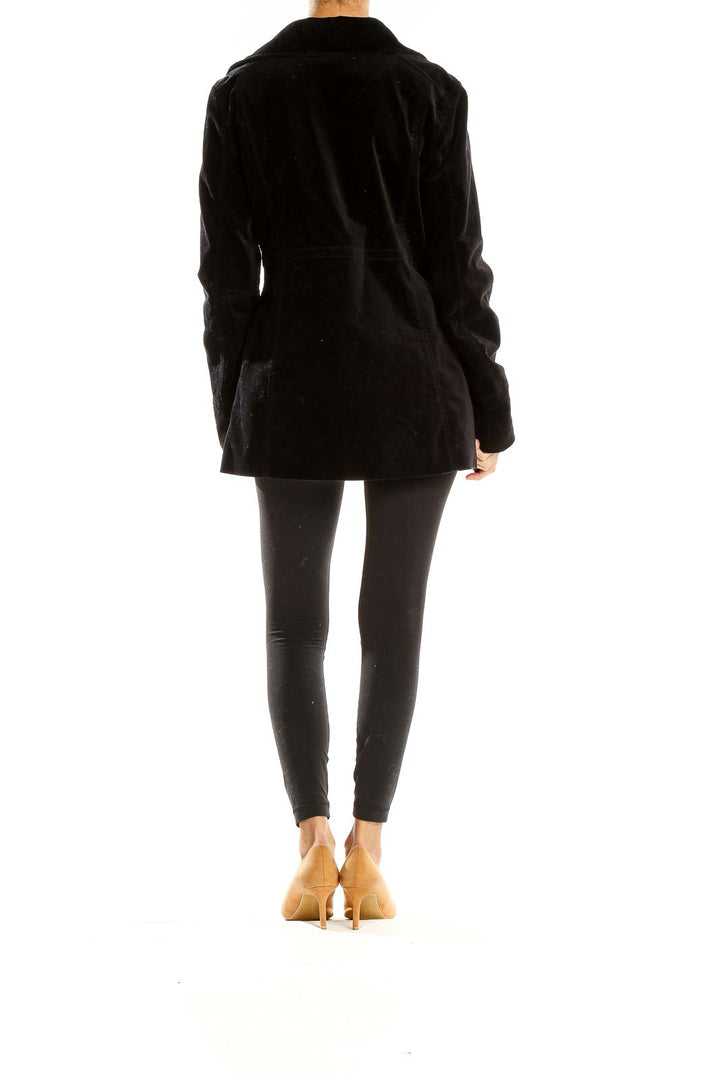 Side view of Calvin Klein Jeans black velvet double-breasted peacoat on model