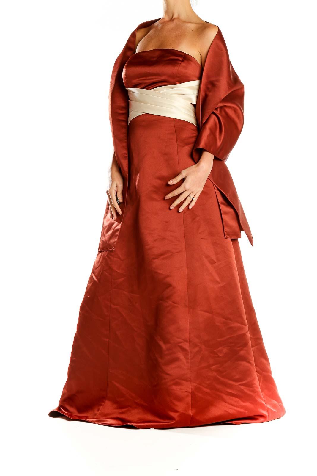 Front view of rust-colored Bill Levkoff strapless satin evening gown with cream sash