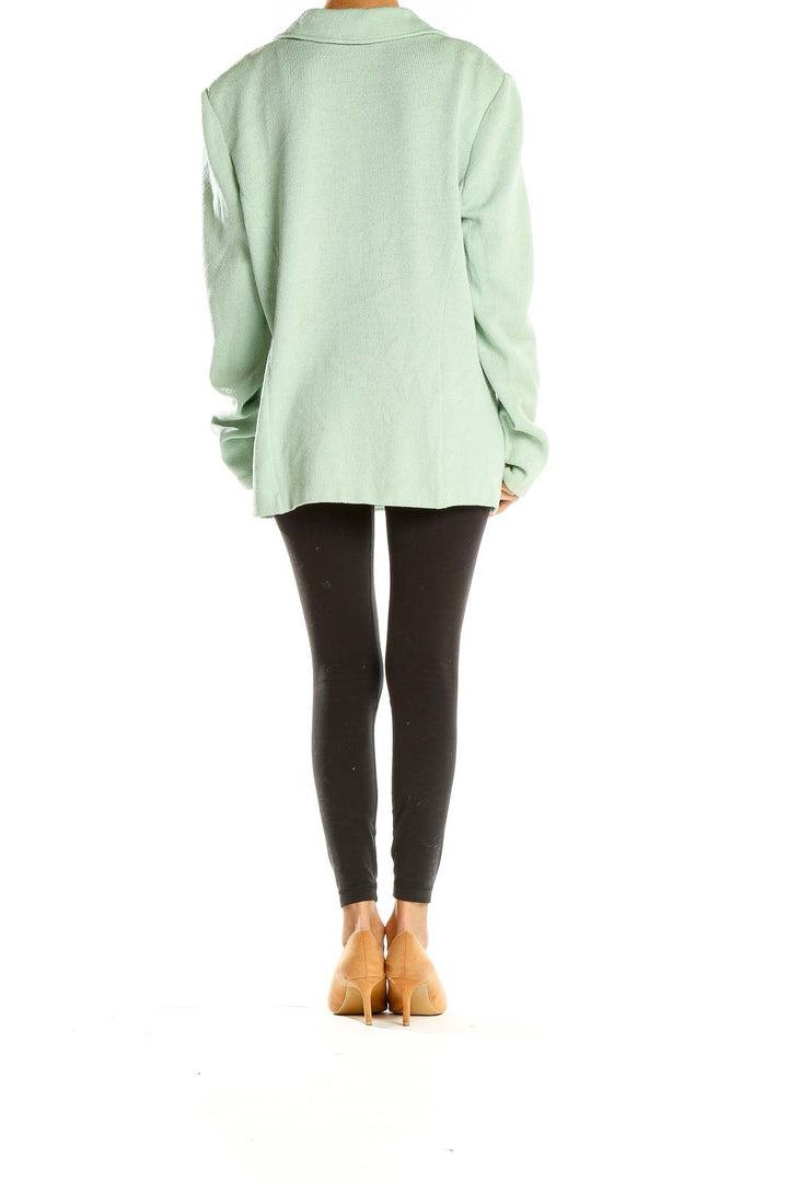 Side view of mint green St. John oversized blazer jacket on model
