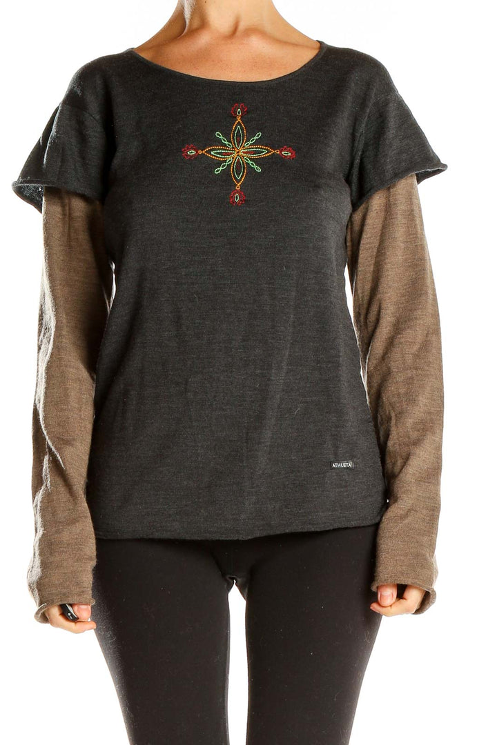 Front view of Athleta charcoal layered top with embroidered floral design