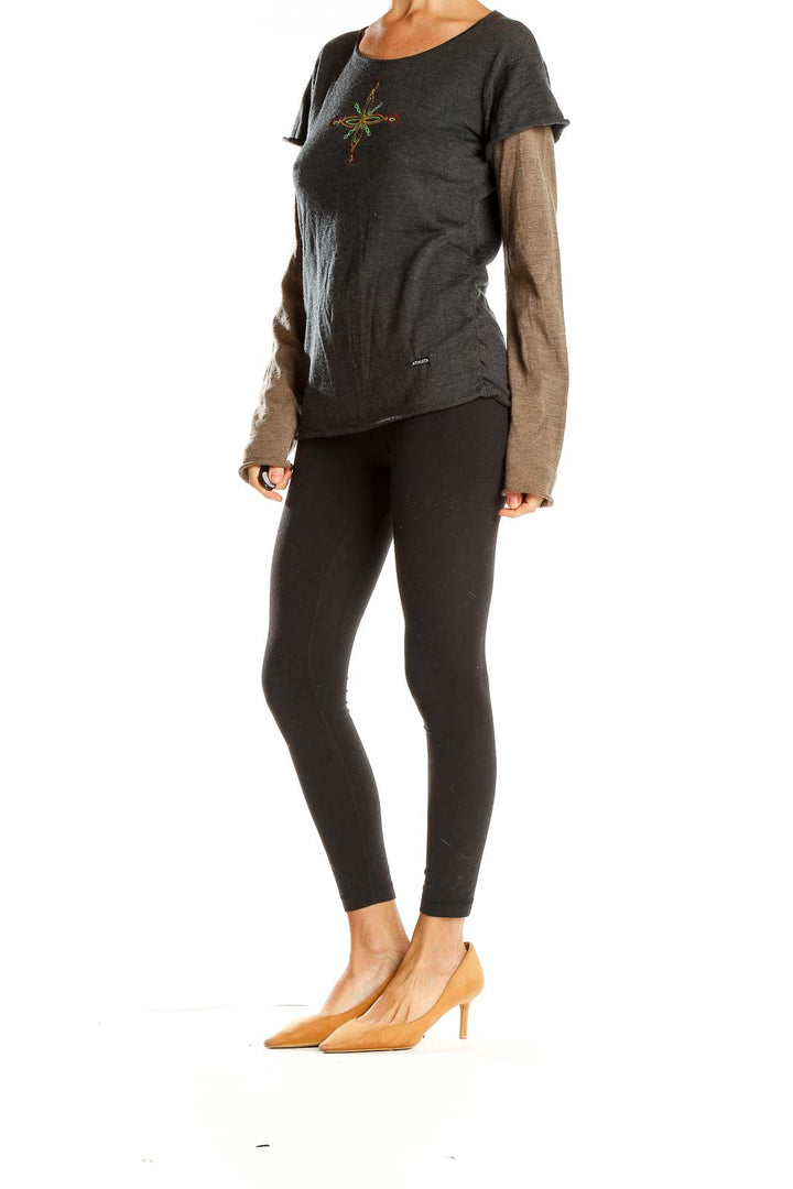 Front view of Athleta charcoal layered top with embroidered floral design