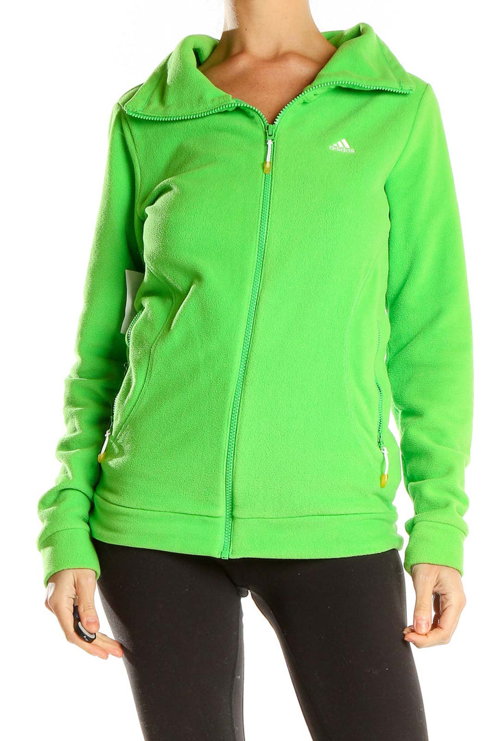 Front view of green Adidas fleece full-zip jacket on model