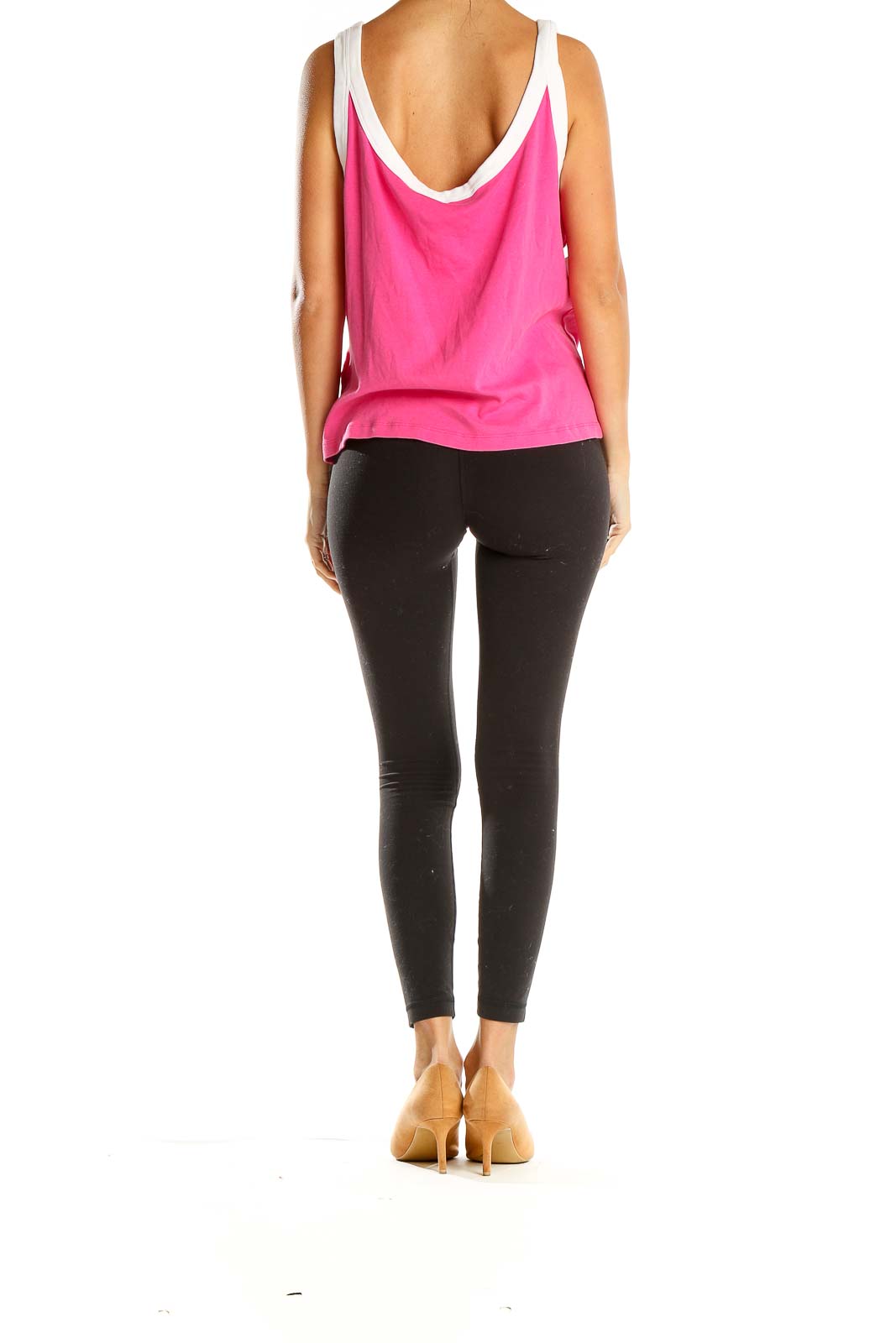 Side view of pink Lauren Active Ralph Lauren sleeveless tank top paired with black leggings