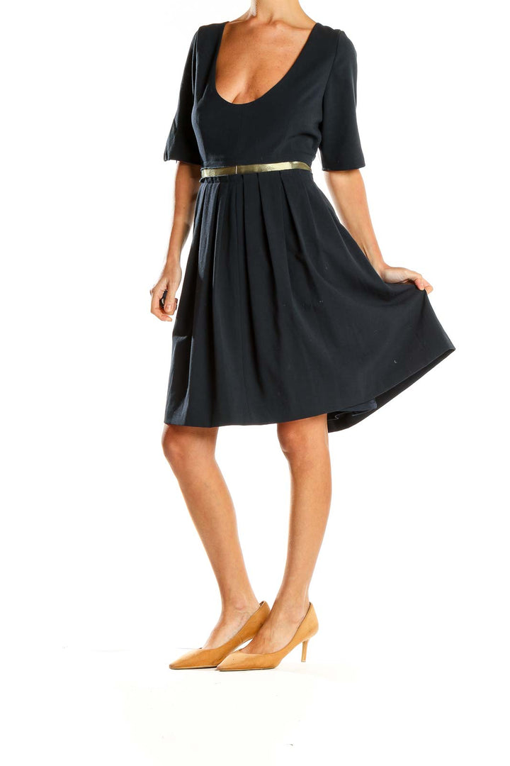 Front view of black MARC NEW YORK ANDREW MARC cocktail dress with scoop neck and gold-tone belt