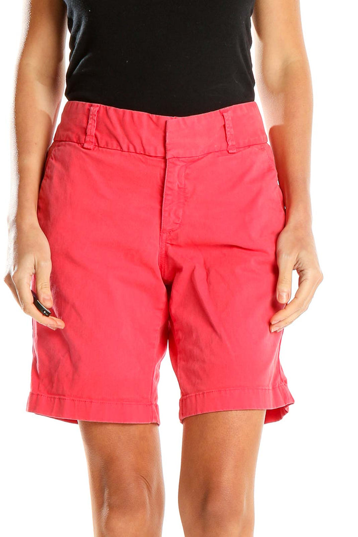 Front view of J.Crew coral chino shorts on model