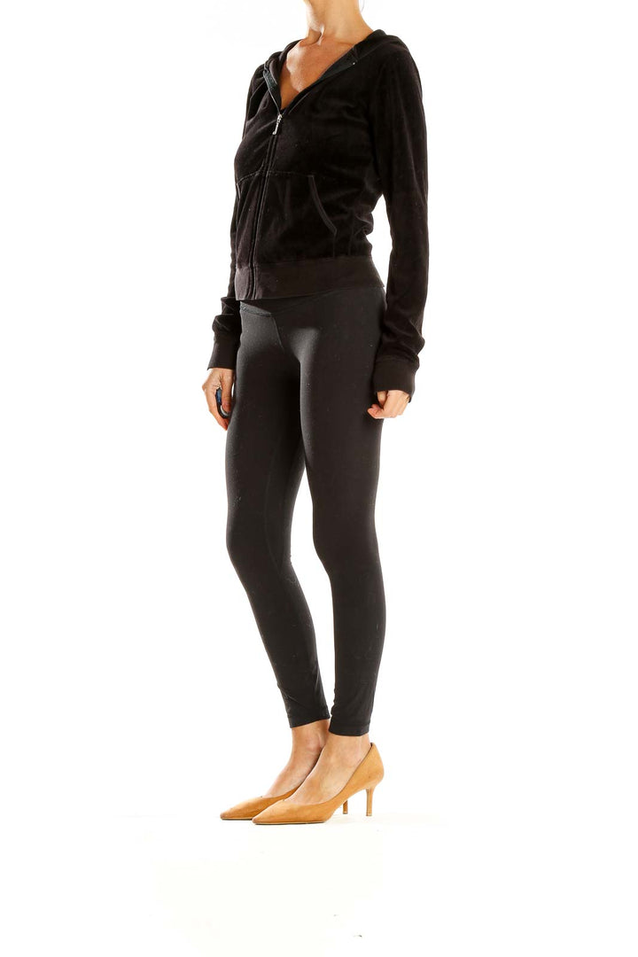 Front view of Juicy Couture black velour zip-up hoodie jacket