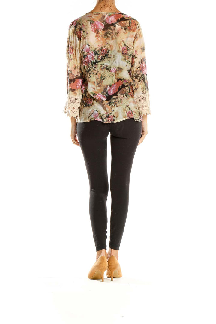 Side view of Adiva beige floral blouse showing lace-trimmed bell sleeves