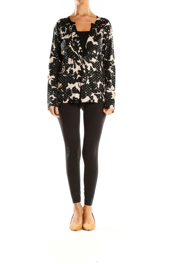 Front view of I.N.C black and white floral print knit cardigan with open front