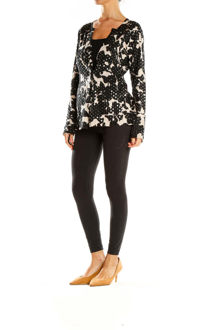 Front view of I.N.C black and white floral print knit cardigan with open front