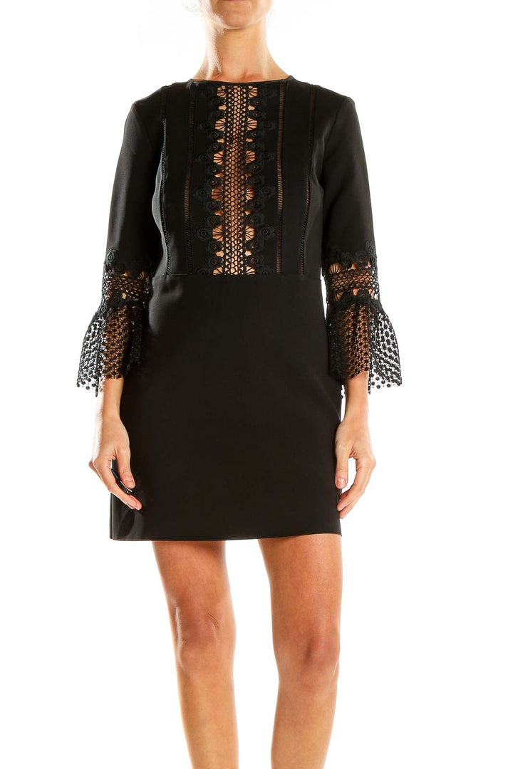 Front view of Self-Portrait black mini dress with lace detailing and bell sleeves