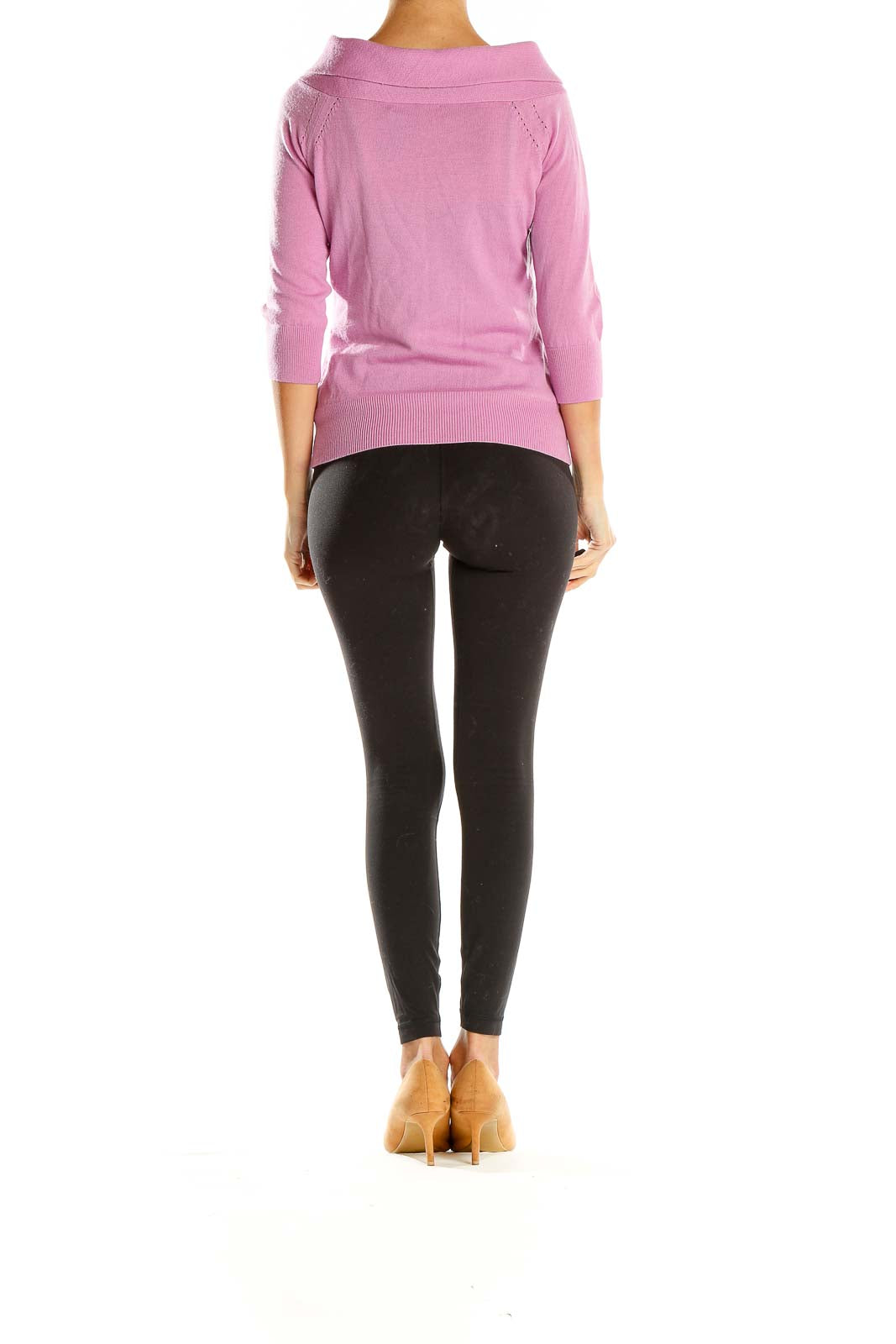 Side view of pink Banana Republic knit sweater on model with black pants