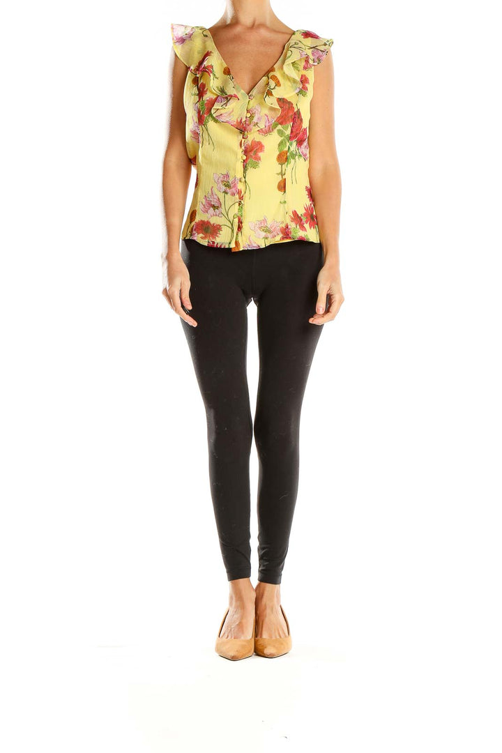 Front view of BB Dakota yellow floral blouse with ruffled cap sleeves and button-up front