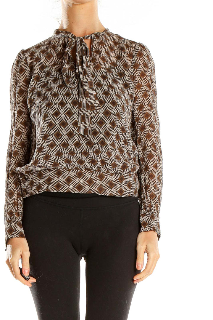 Front view of Fossil brown geometric print sheer blouse with gathered neckline