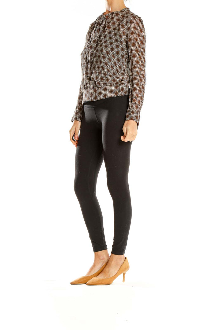Front view of Fossil brown geometric print sheer blouse with gathered neckline