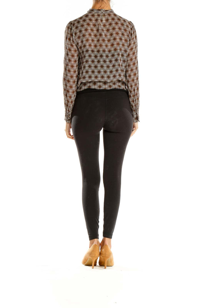 Side view of Fossil brown geometric print sheer blouse showing relaxed fit
