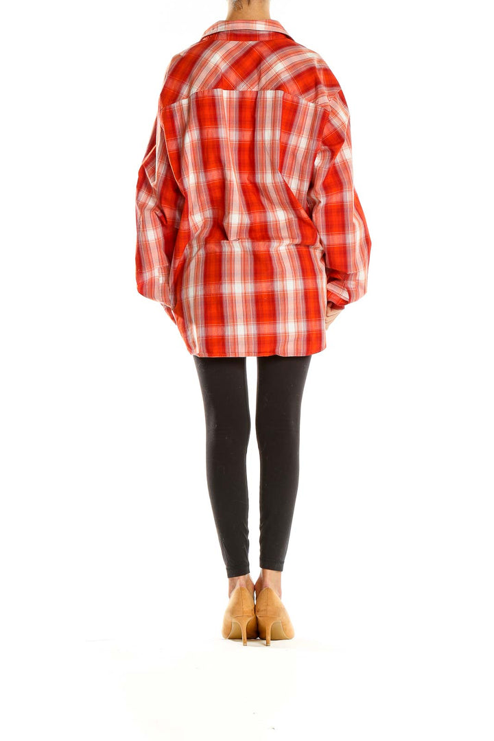 Back view of red plaid Columbia button-down shirt on model
