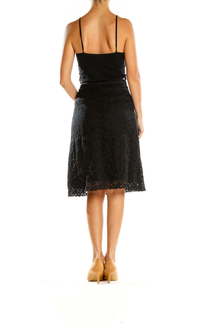 Side view of Banana Republic black lace A-line skirt showing silhouette