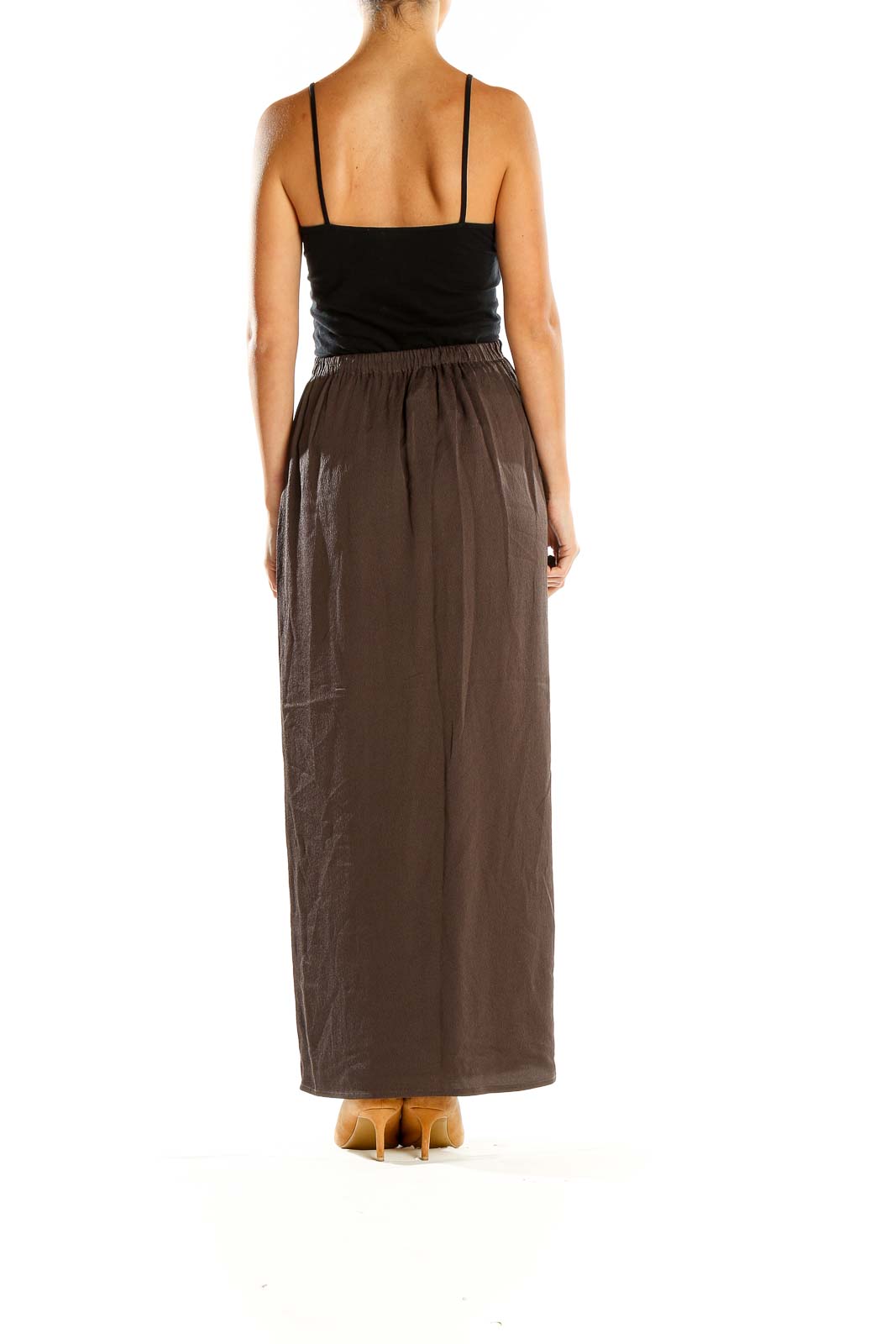 Side view of brown Eileen Fisher maxi skirt on model with black top
