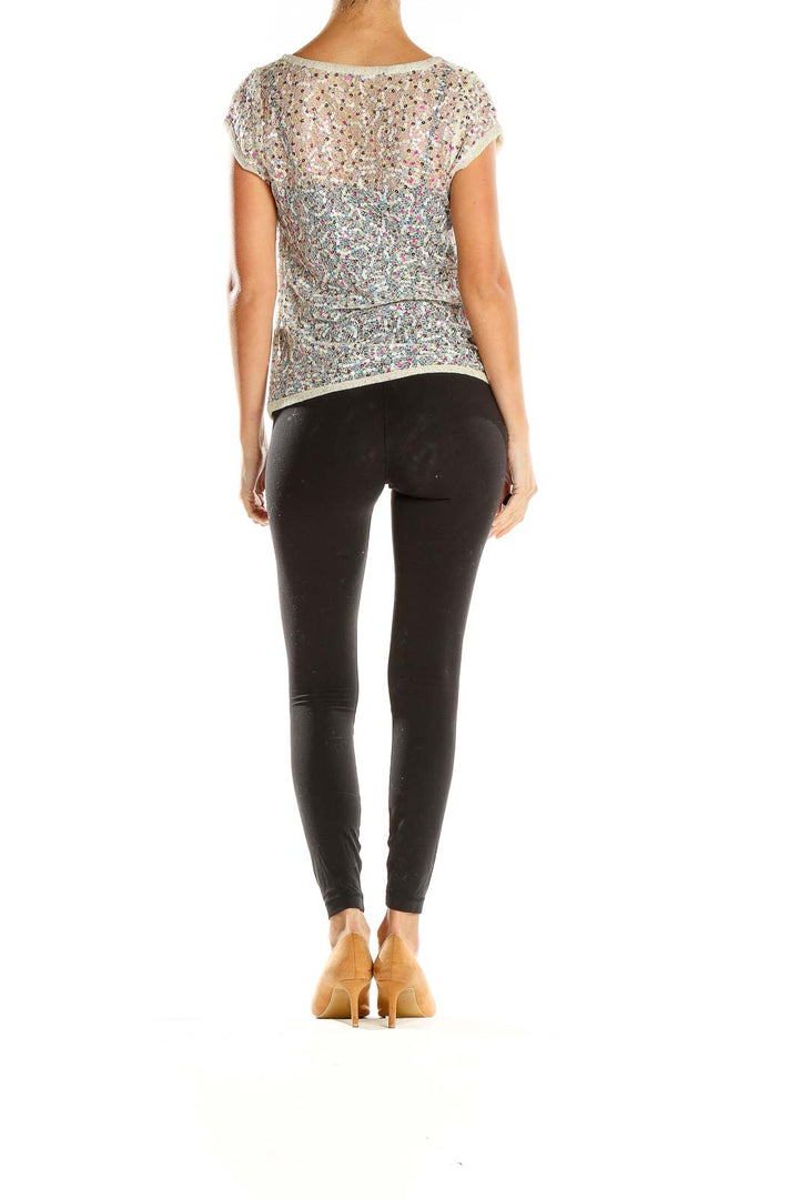 Side view of SilkRoll multicolor sequin cap sleeve top showing iridescent design