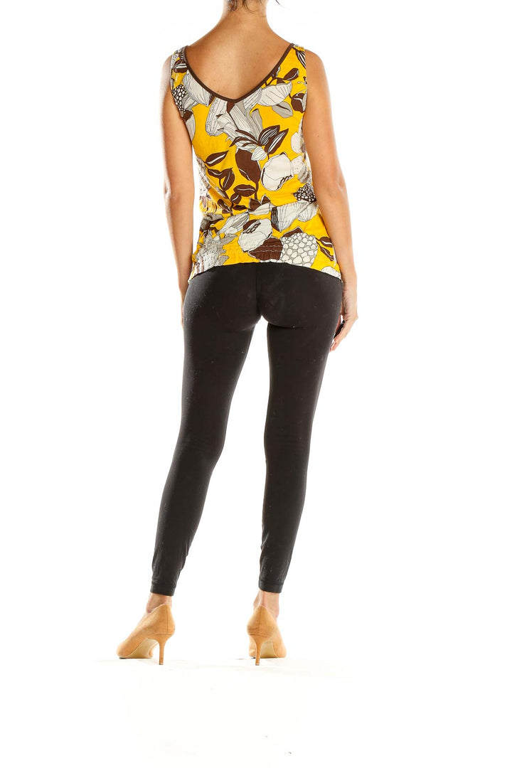 Side view of Miss Sixty yellow floral print sleeveless top showing adjustable side ties