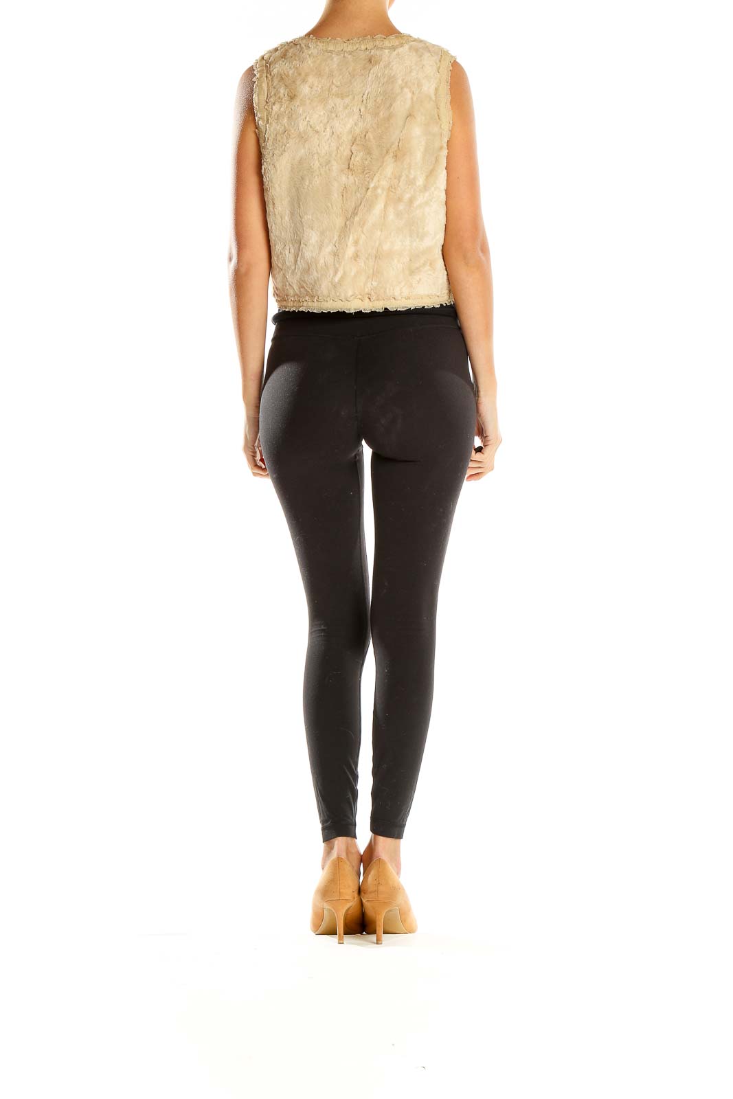 Side view of model wearing Rebecca Taylor beige faux fur cropped vest with black outfit