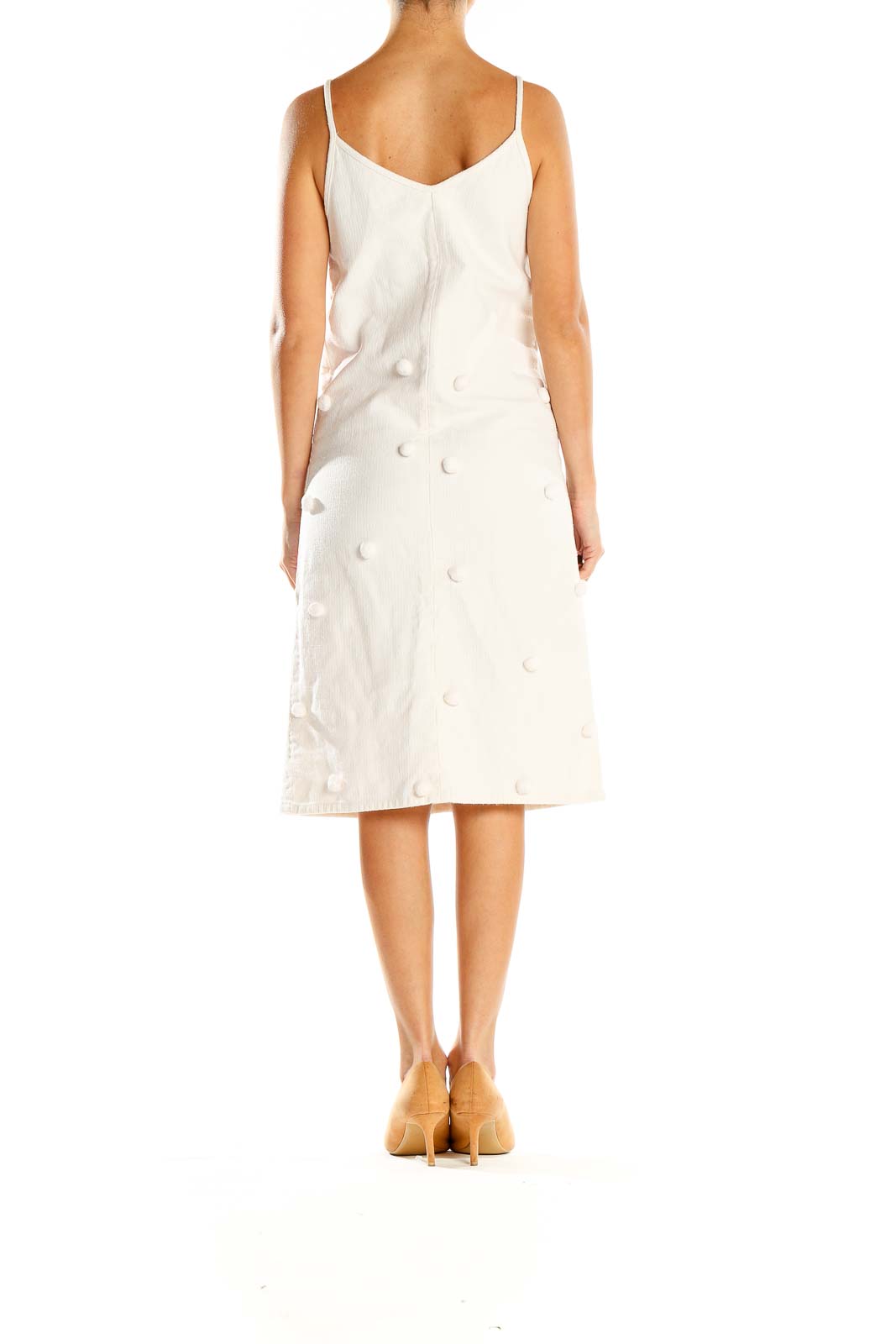 Side view of Apiece Apart white textured button-front midi dress showing A-line silhouette