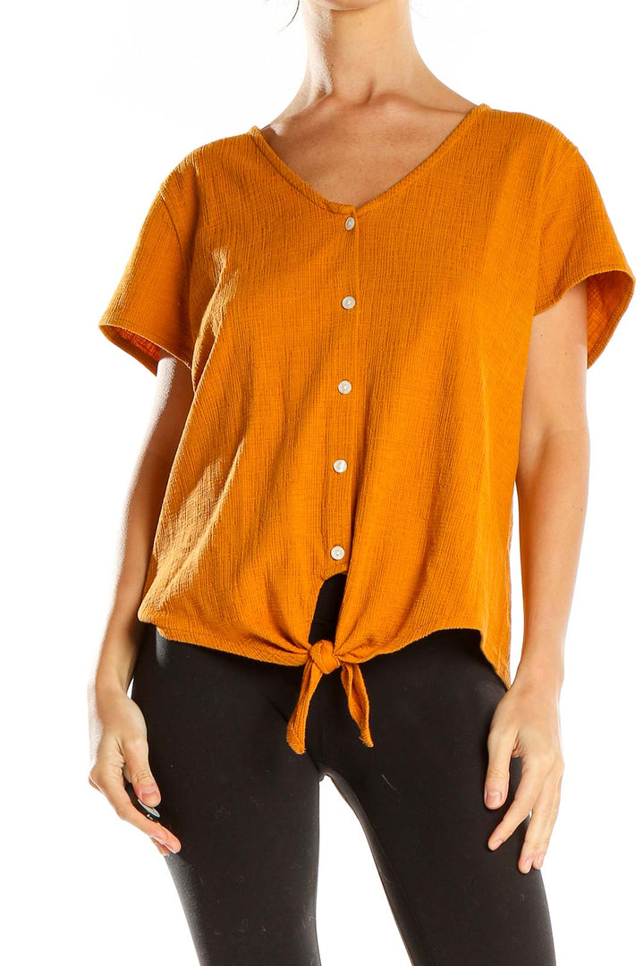 Front view of orange J.Crew button-front top with tie-waist detail