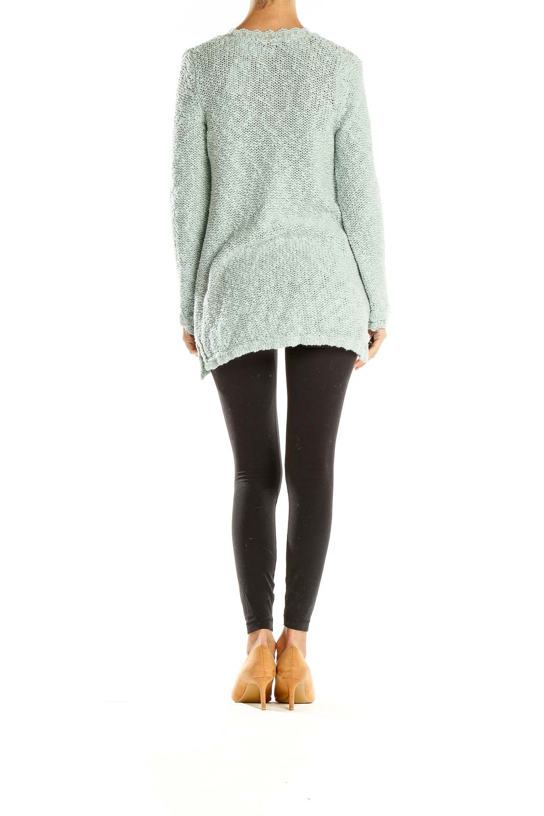 Side view of model wearing mint green Zara Knit cardigan over black outfit