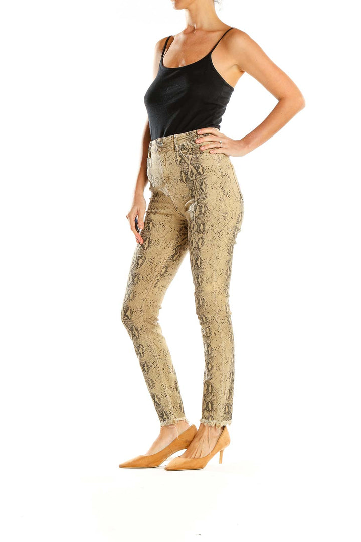 Front view of Zara beige snake print high-waisted skinny pants