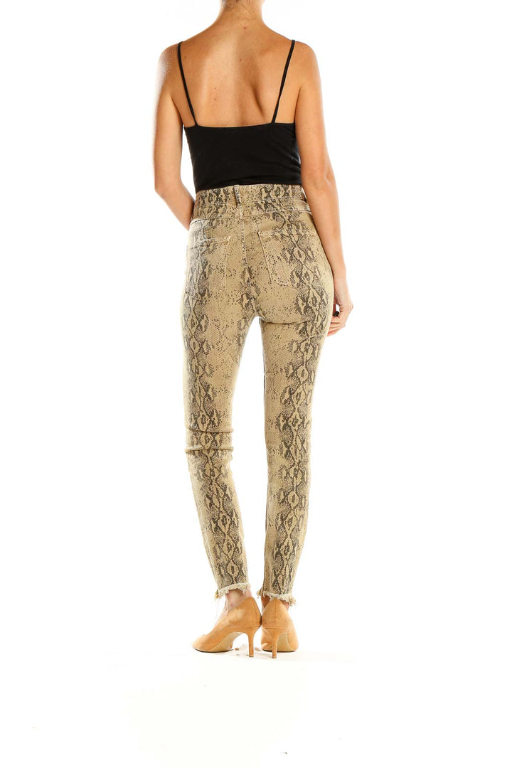 Side view of model wearing Zara beige snake print high-waisted skinny pants
