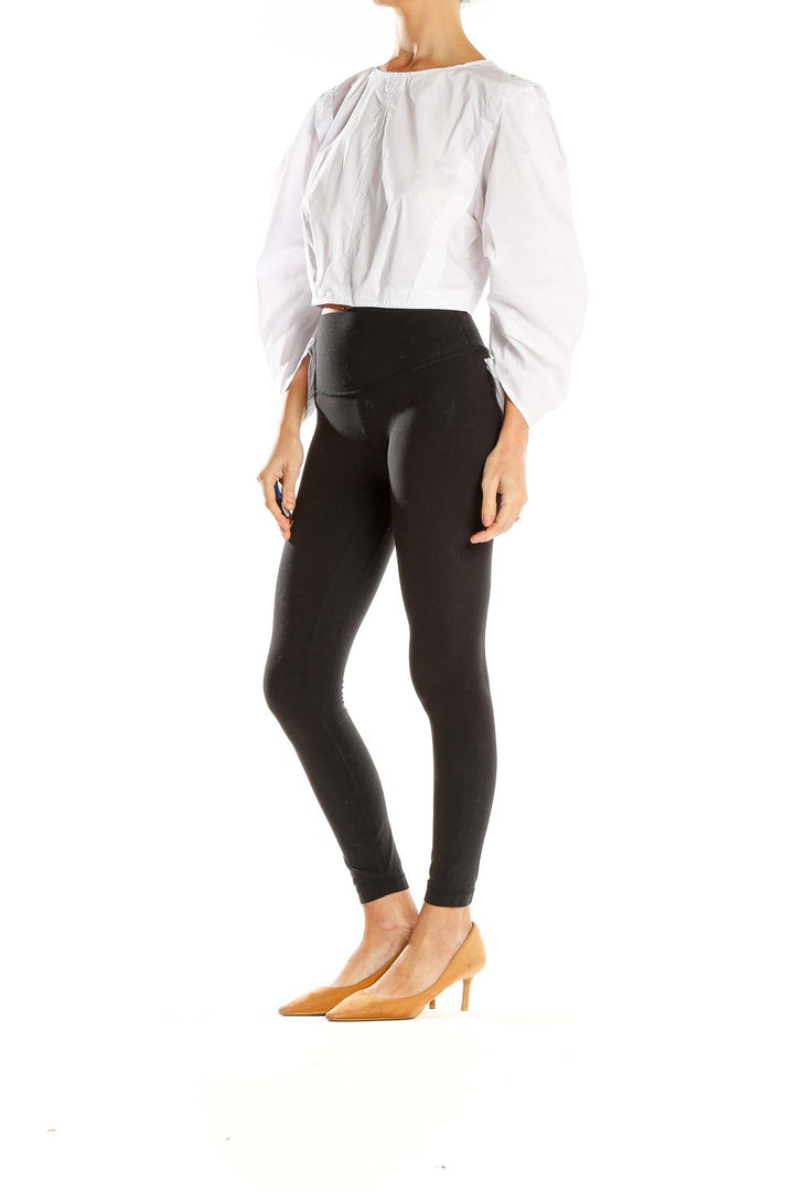 Front view of Olivaceous white cropped top with puff sleeves