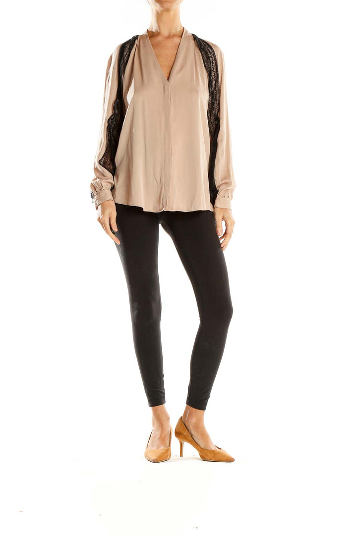 Front view of Kobi Halperin beige blouse with black lace trim and V-neckline