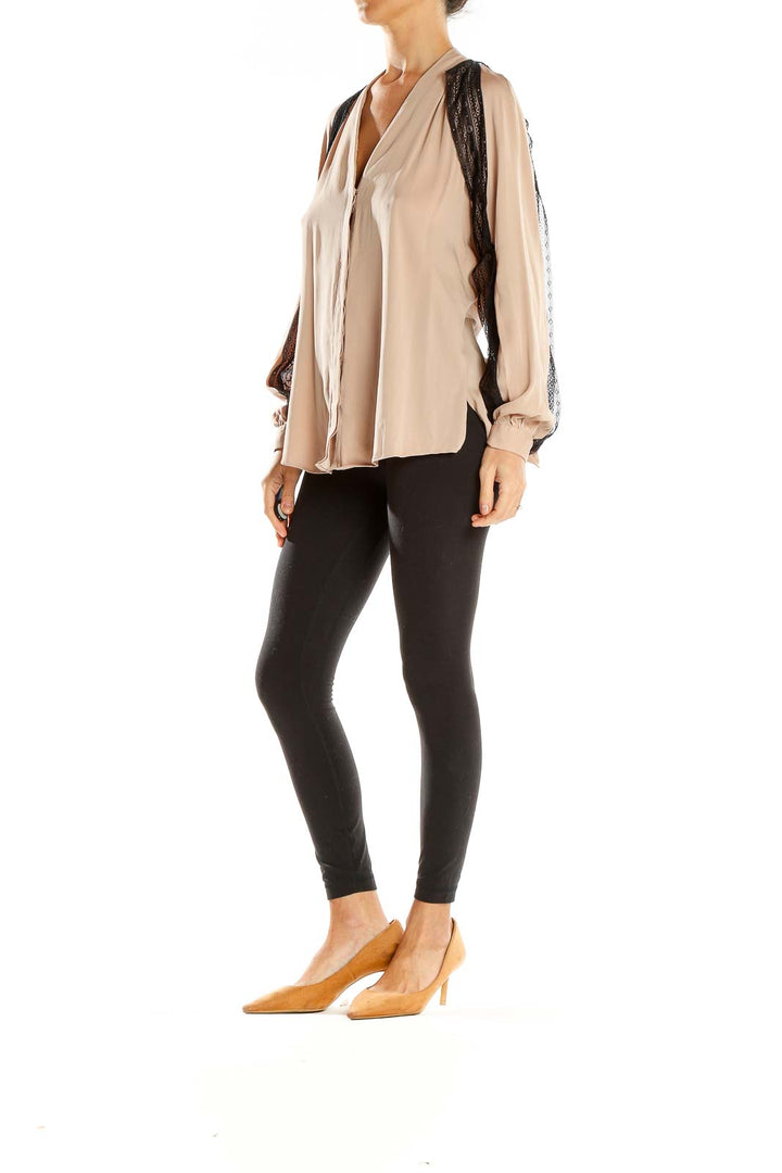 Front view of Kobi Halperin beige blouse with black lace trim and V-neckline