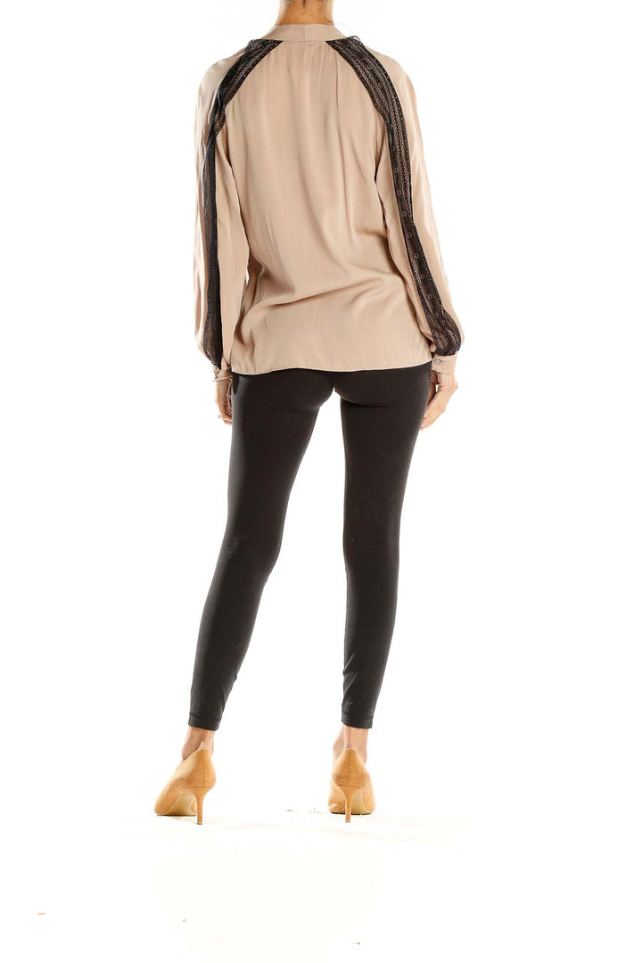 Side view of Kobi Halperin beige blouse showing lace-trimmed sleeves and relaxed fit