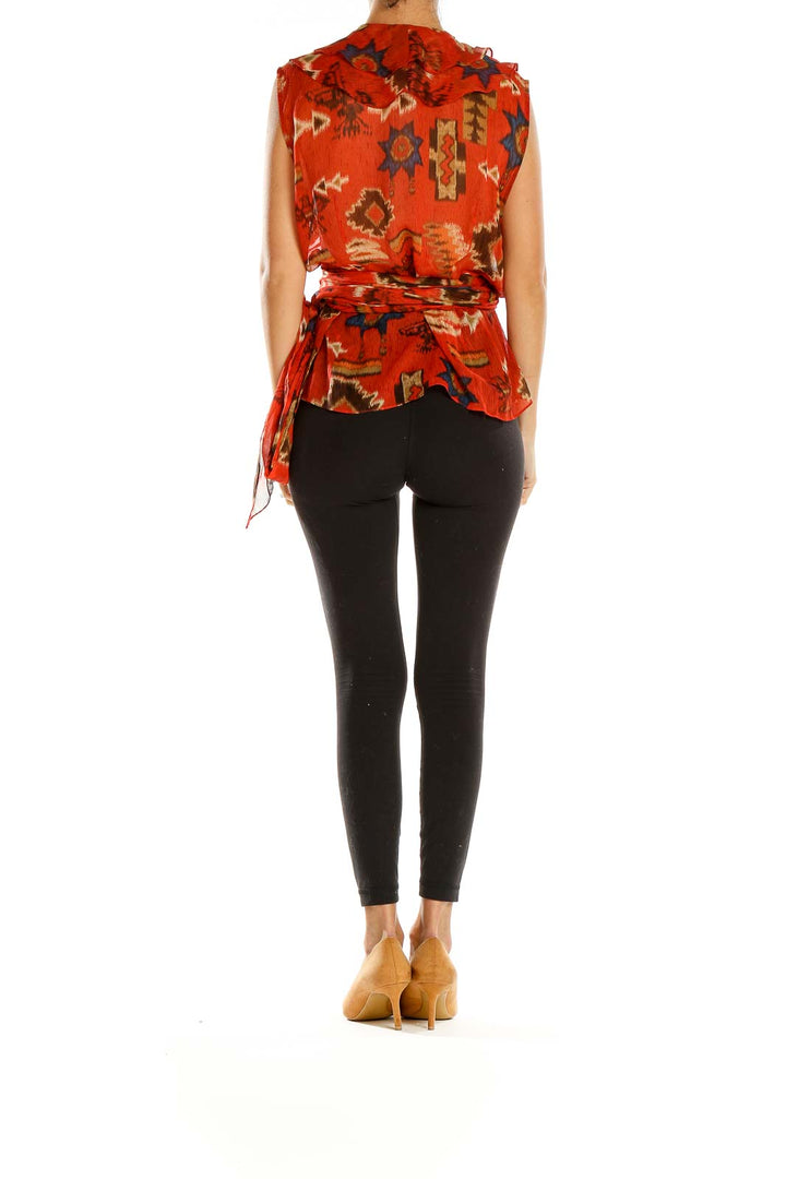 Side view of Lauren Ralph Lauren red floral ruffled wrap top paired with black pants