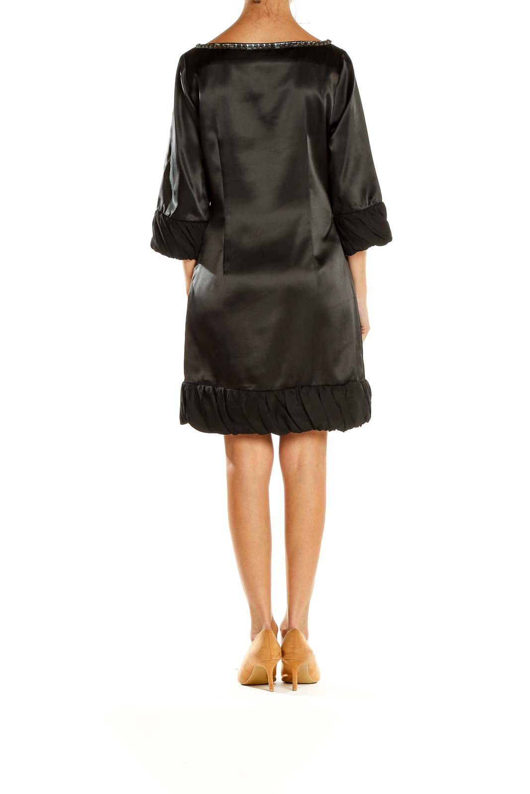 Side view of Pollini black satin cocktail dress showing ruffle cuffs and hem