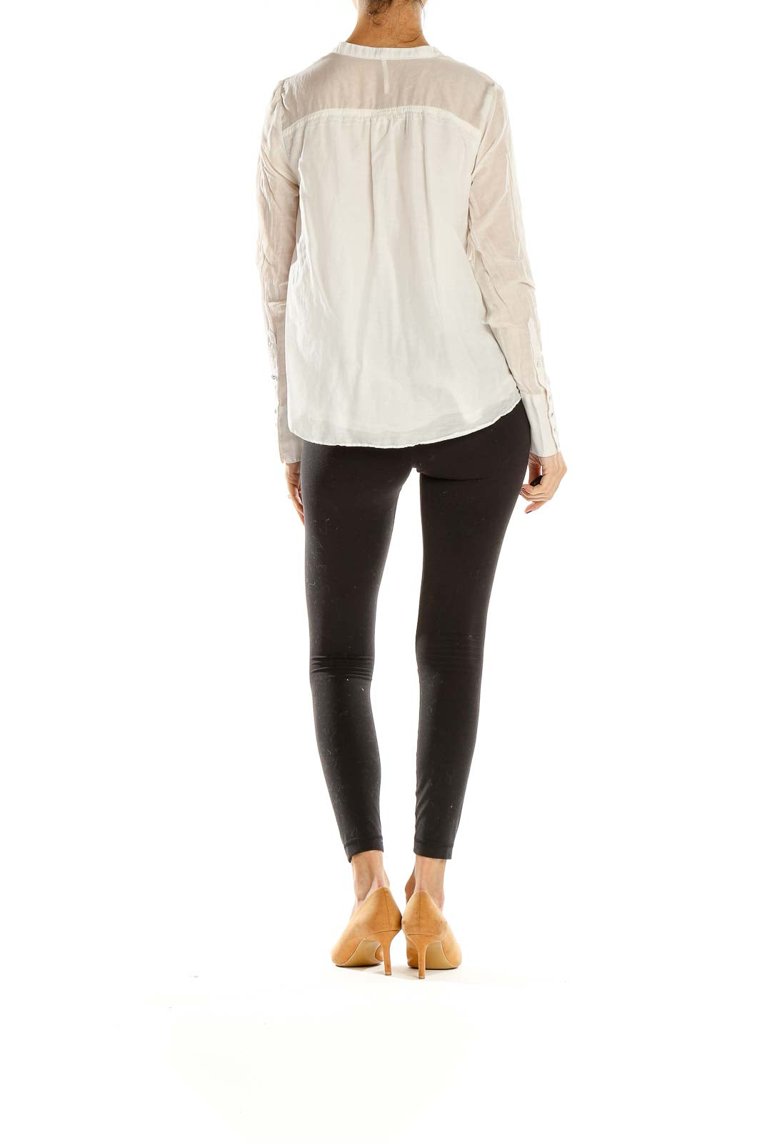 Back view of Free People white sheer blouse showing relaxed fit and gathered waist