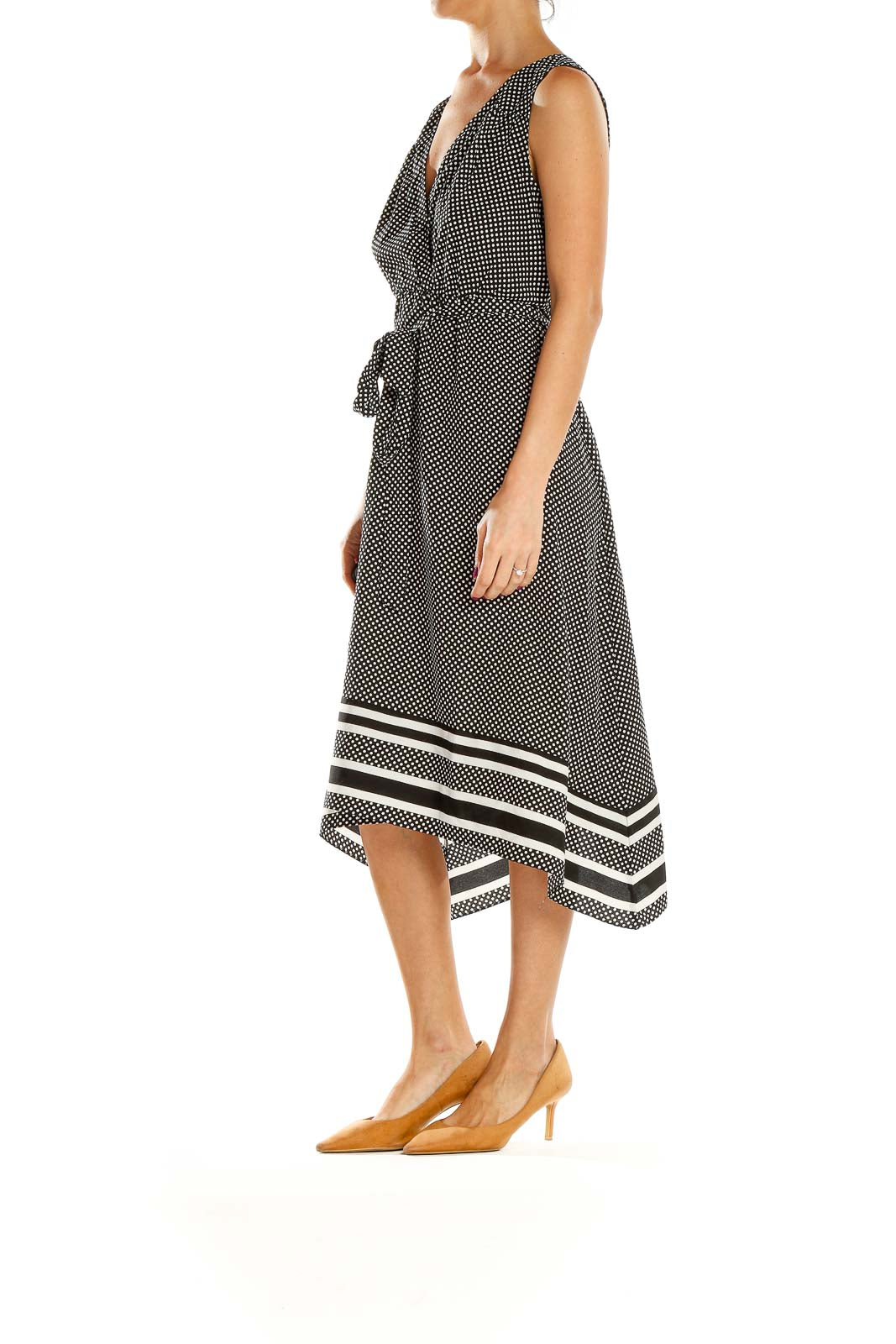 Front view of black and white polka dot maternity midi dress with V-neck and wrap bodice