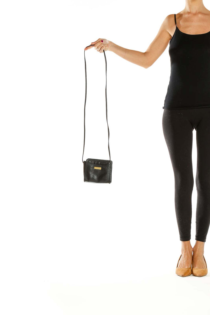 Front view of Anne Klein II black leather crossbody bag with gold-tone hardware