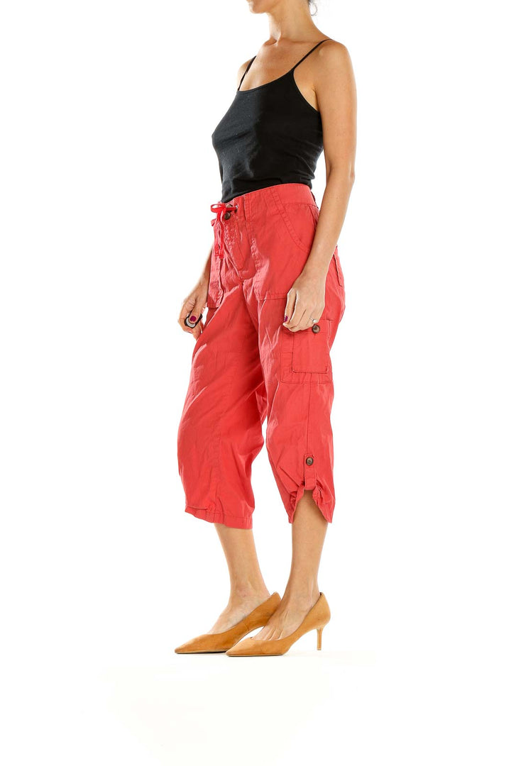 Front view of red Lee cargo capri pants with side pockets