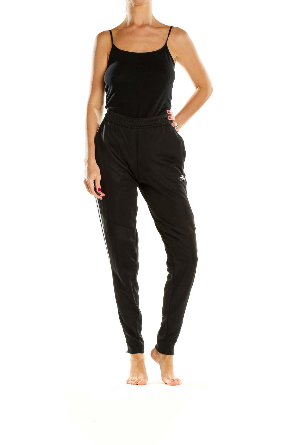 Front view of black Adidas track pants with white stripes