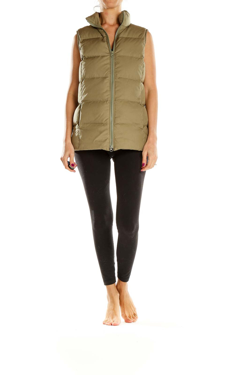 Front view of olive Gap quilted puffer vest on model