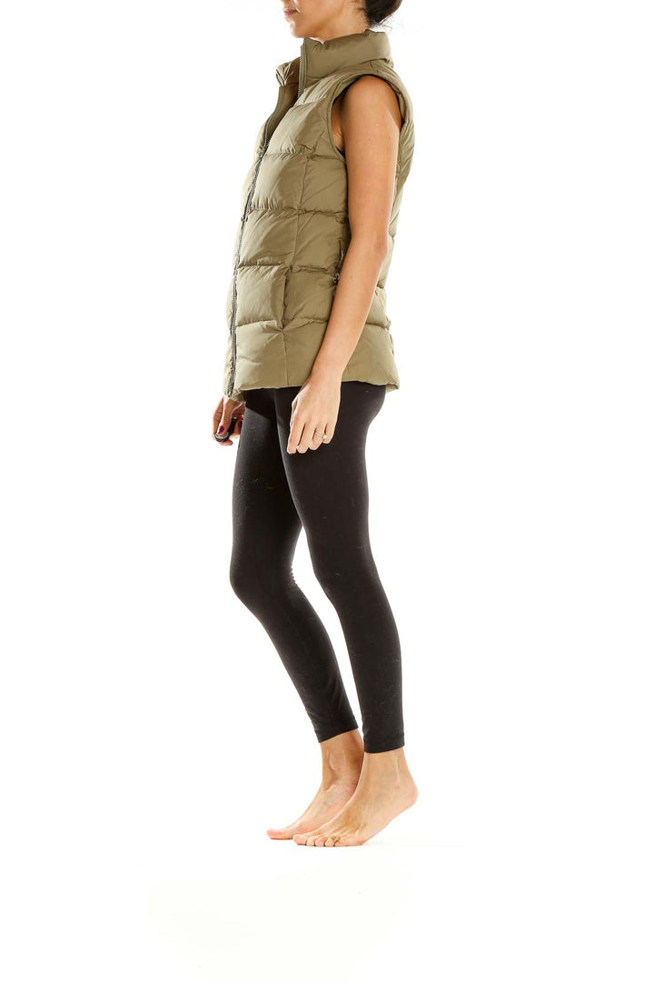 Front view of olive Gap quilted puffer vest on model