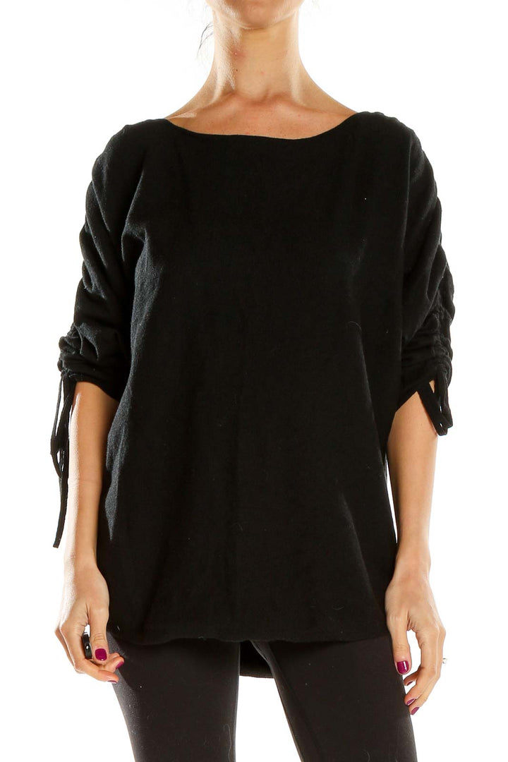 Front view of Max Studio black oversized knit sweater with ruched sleeves