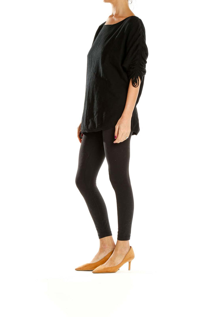 Front view of Max Studio black oversized knit sweater with ruched sleeves