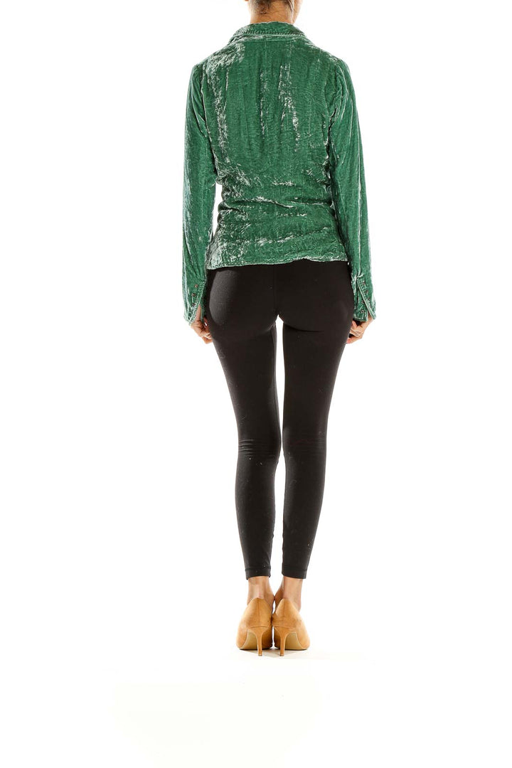 Back view of Elie Tahari green velvet blazer jacket on model