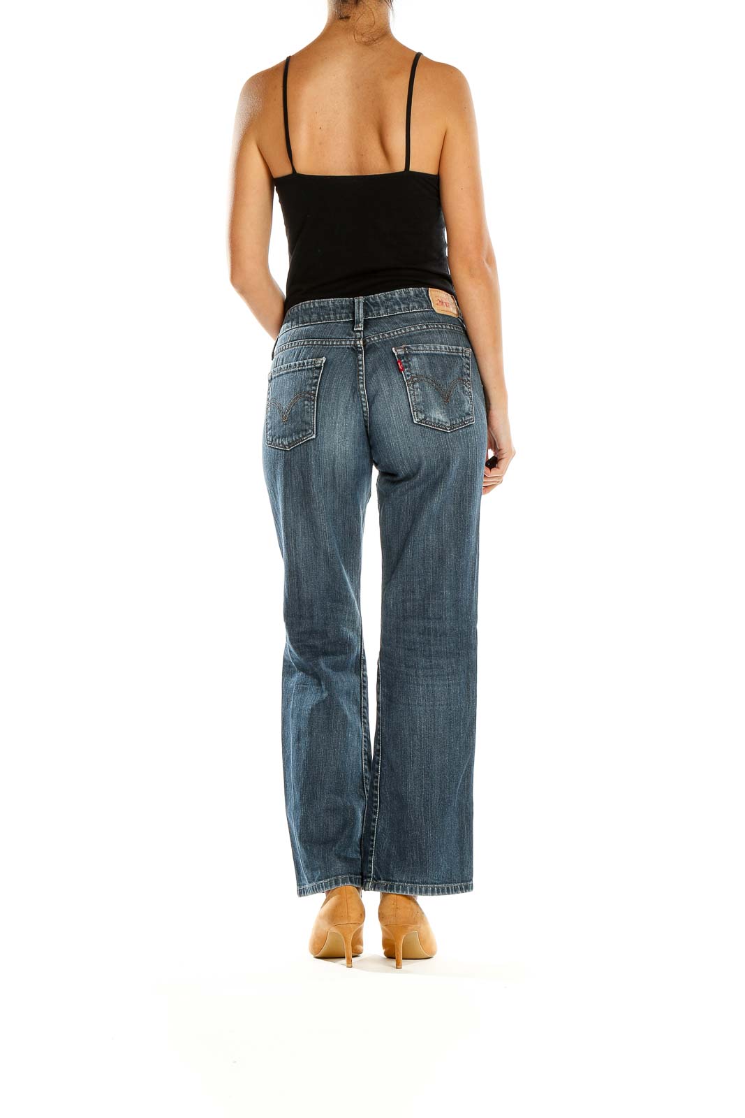 Back view of Levi's blue bootcut jeans on model
